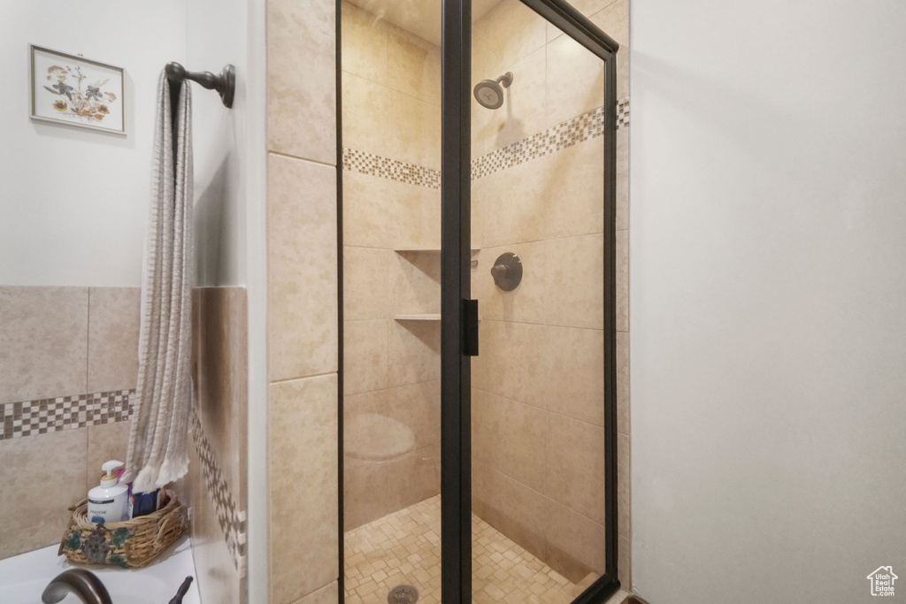 Full bath with a shower stall