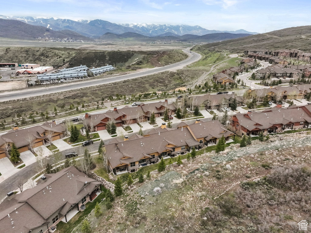 Drone / aerial view with a residential view and a mountain view