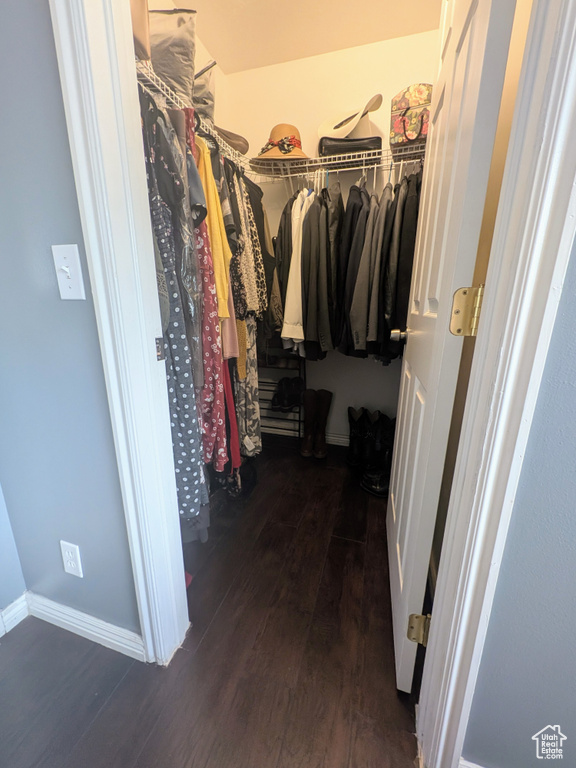 Walk in closet featuring wood finished floors
