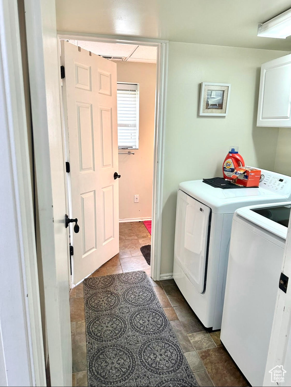 Clothes washing area with cabinet space and washing machine and clothes dryer