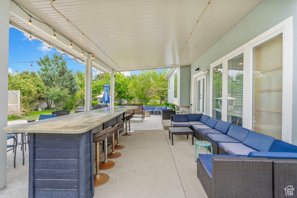 View of patio featuring outdoor lounge area and outdoor dry bar