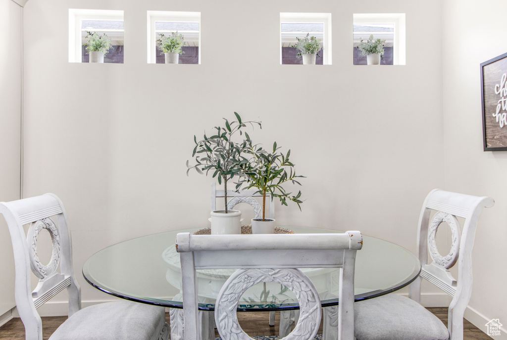 Dining space featuring baseboards and wood finished floors