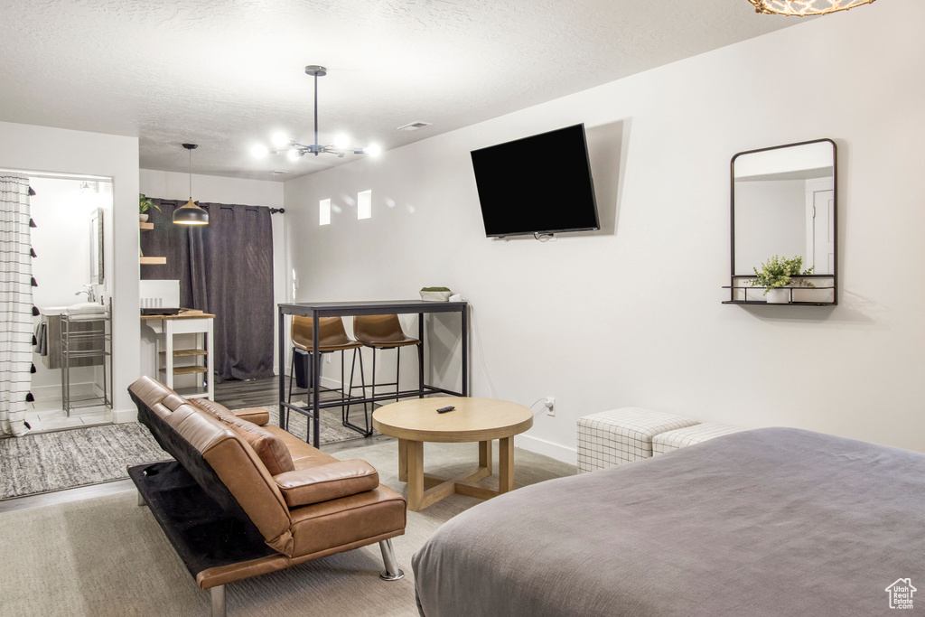 Bedroom featuring baseboards and carpet floors