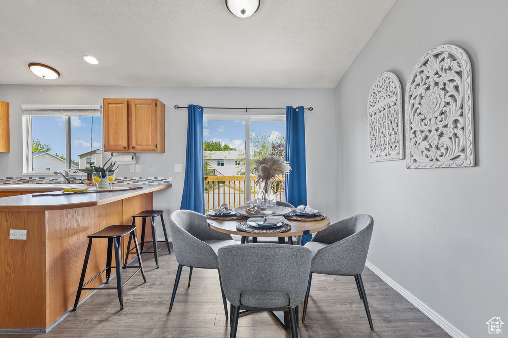 Dining room featuring recessed lighting, baseboards, and wood finished floors