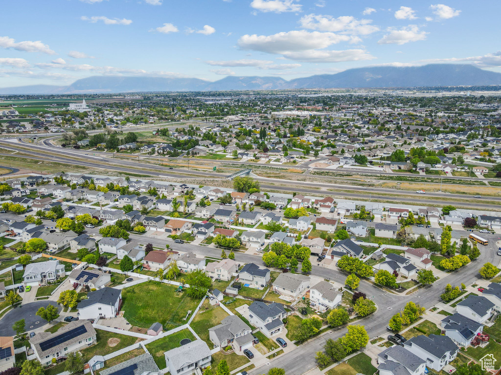 Birds eye view of property featuring a mountain view and a residential view