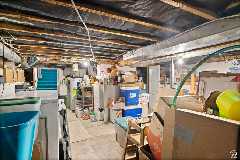 Unfinished below grade area featuring electric water heater