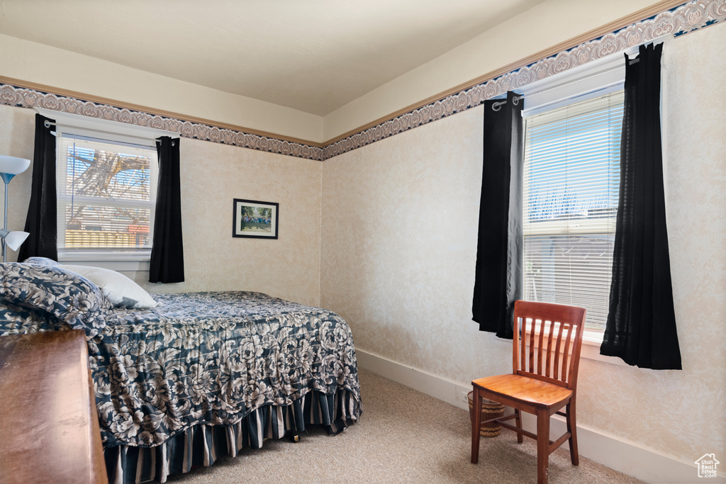 Carpeted bedroom with baseboards