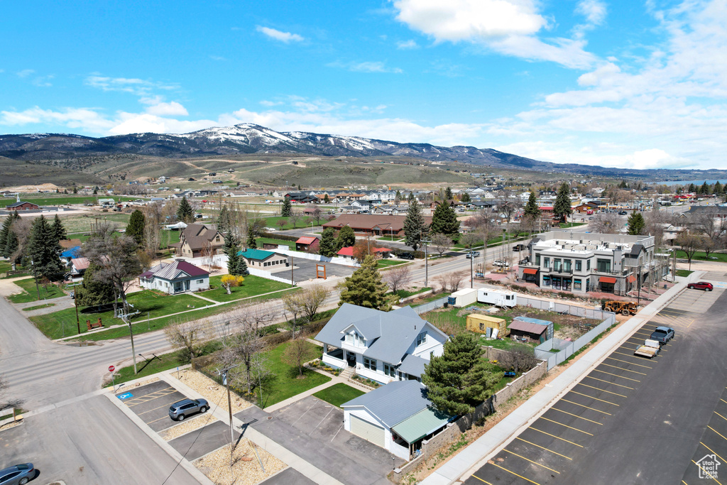 Birds eye view of property featuring a mountain view and a residential view