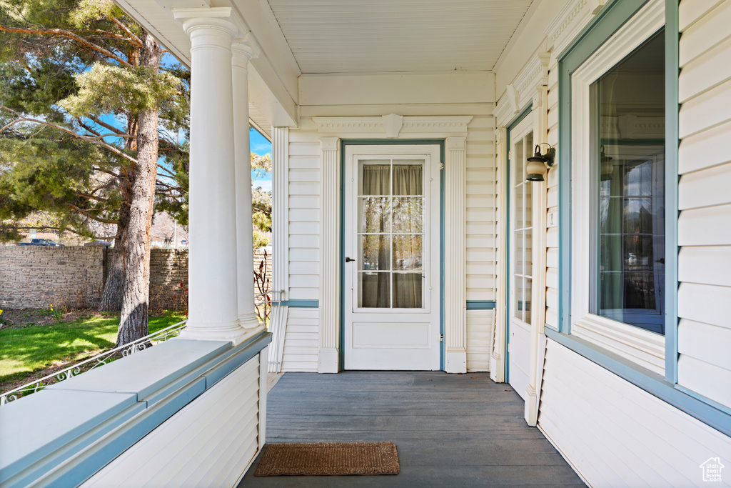 Doorway to property with covered porch