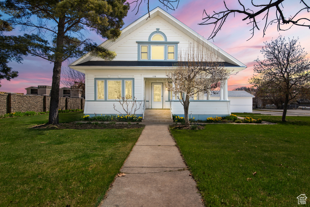 Bungalow with a yard and fence