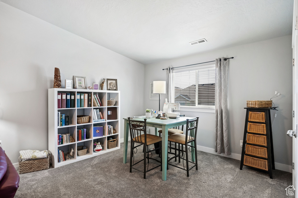 Dining space featuring visible vents, baseboards, and carpet floors