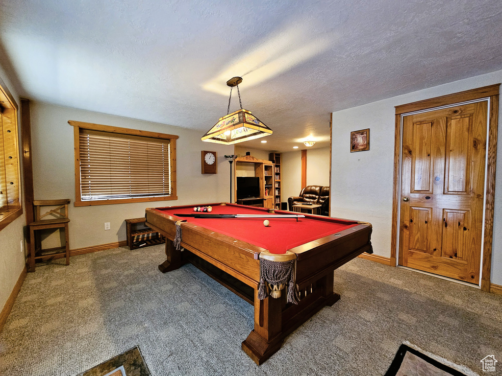 Playroom featuring carpet, a textured ceiling, baseboards, and pool table