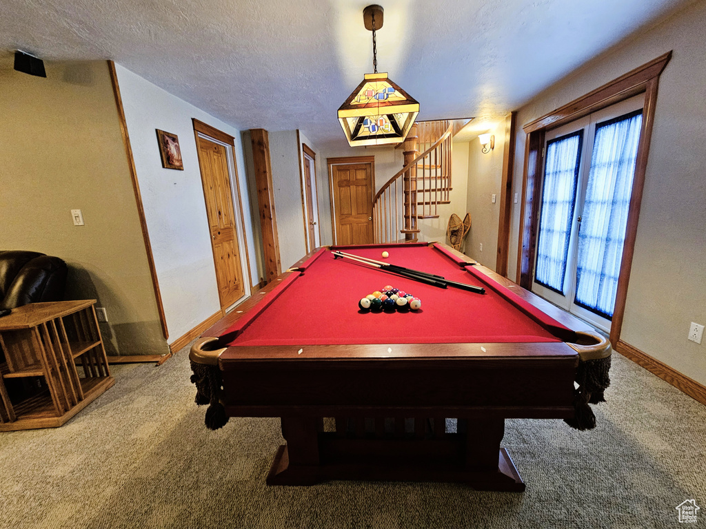 Playroom with carpet flooring, a textured ceiling, billiards, and baseboards