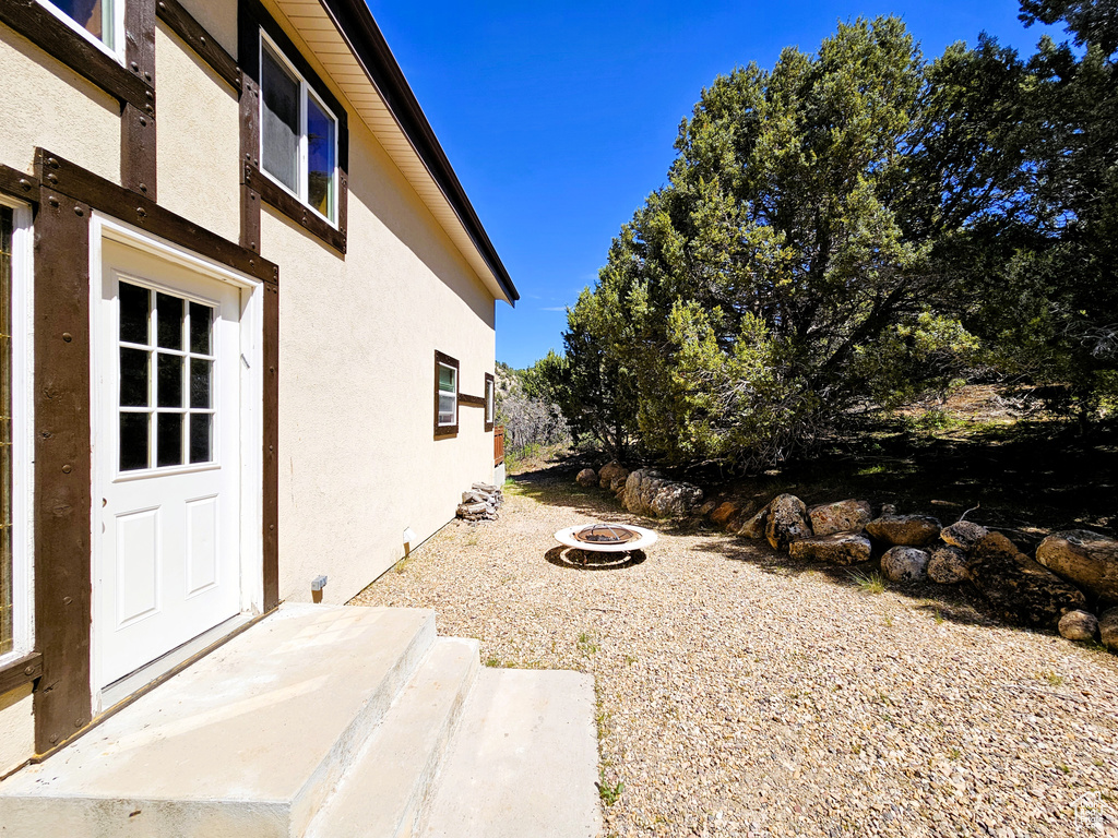 View of yard with an outdoor fire pit