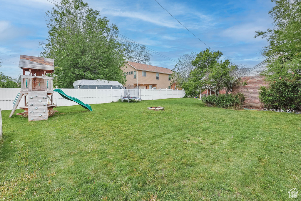 View of yard featuring a playground