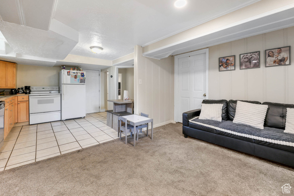 Living room with light carpet and light tile patterned flooring