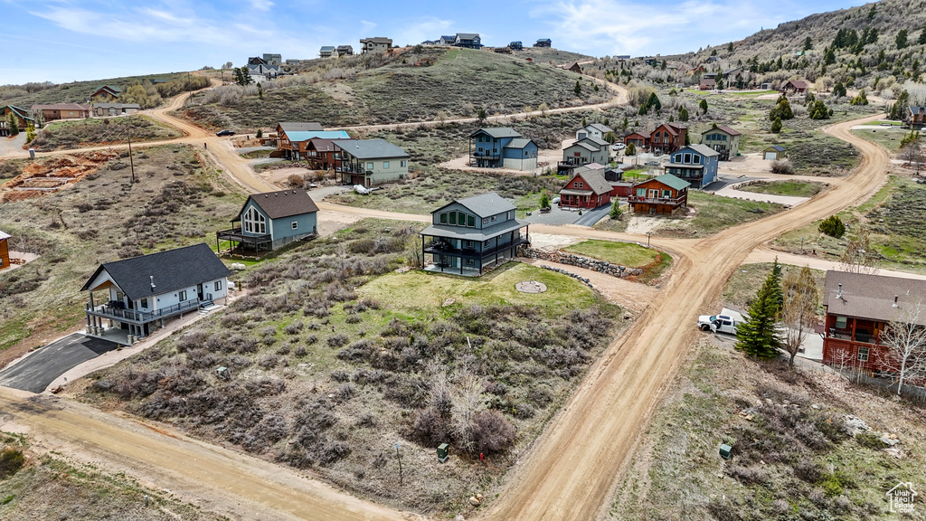 Birds eye view of property with a mountain view and a residential view