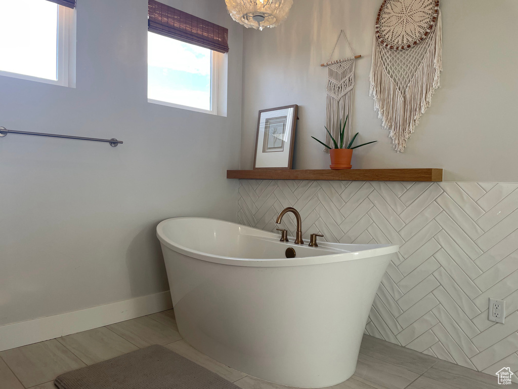 Full bathroom with a soaking tub