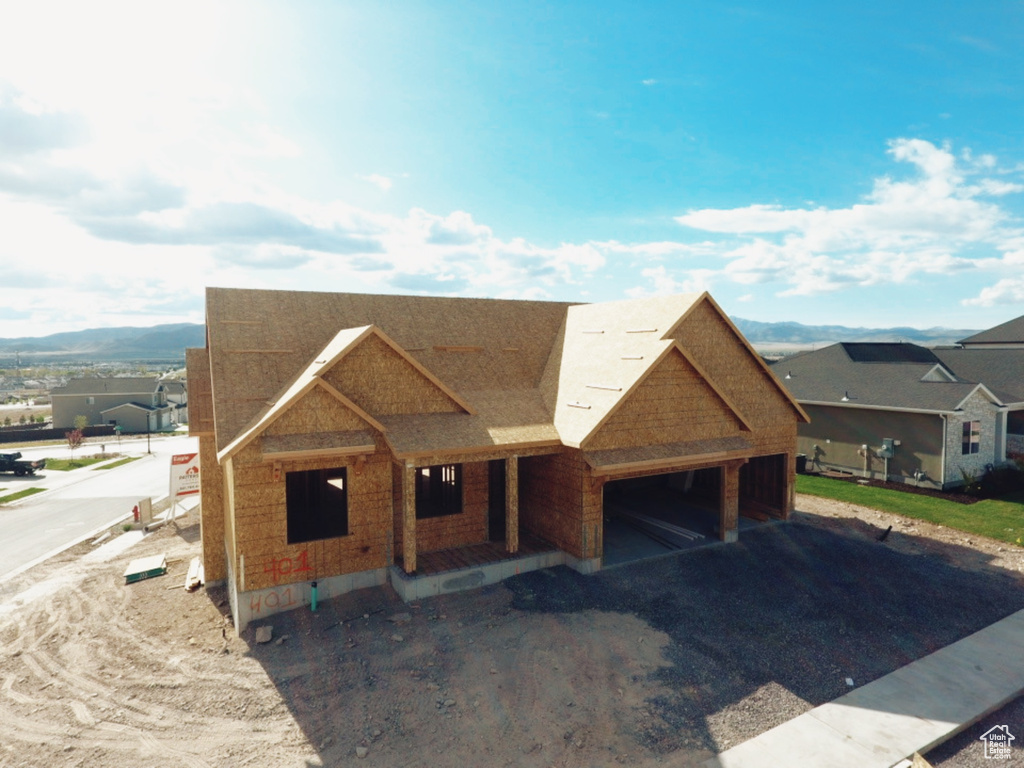 Property in mid-construction with covered porch