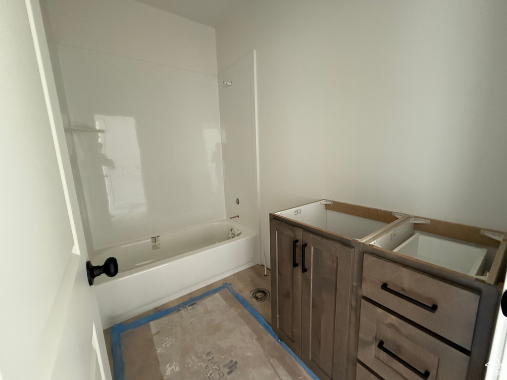 Bathroom featuring bathing tub / shower combination and vanity