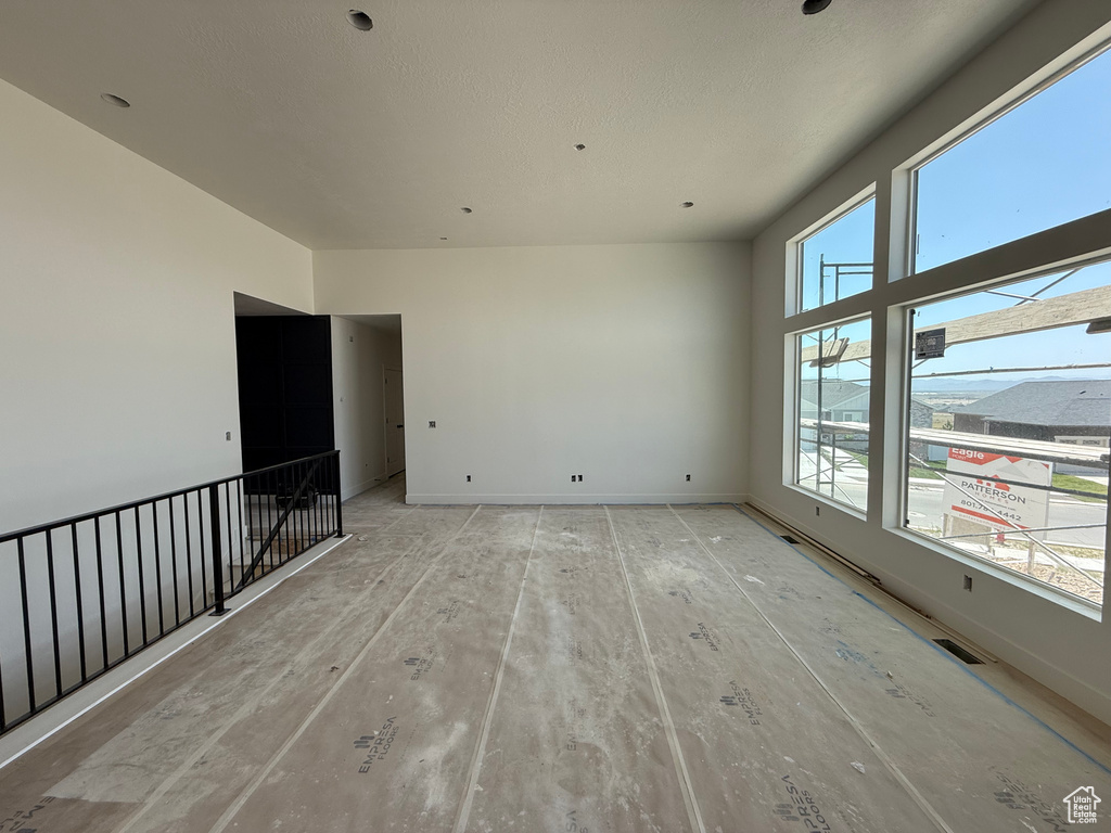 Unfurnished room featuring baseboards