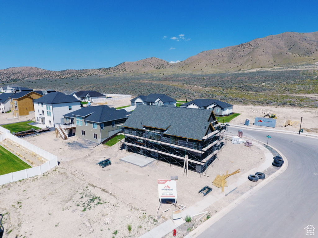 Aerial perspective of suburban area with a mountainous background