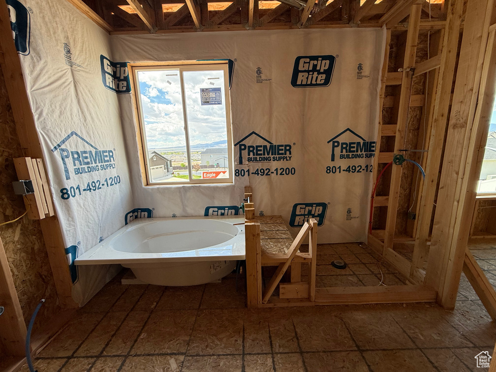 Full bath featuring a bath