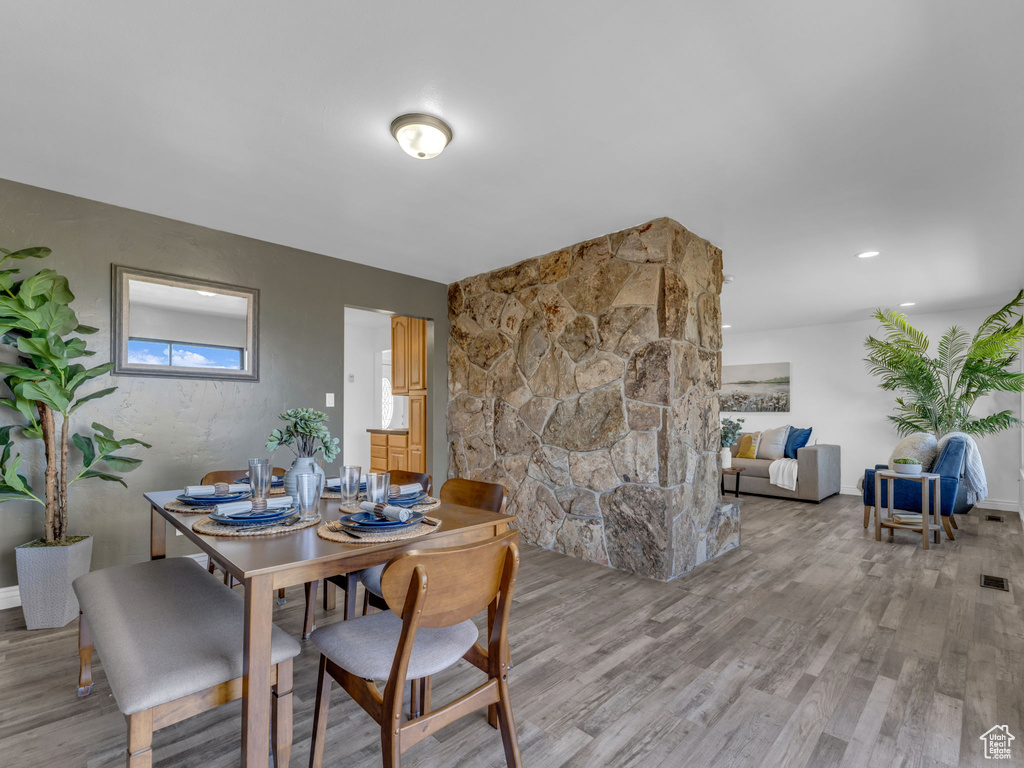 Dining room featuring visible vents and light wood-style floors