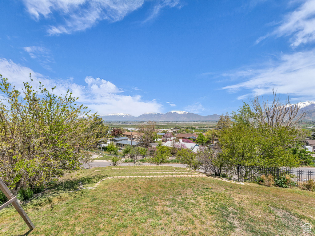 Exterior space with a mountain view and fence