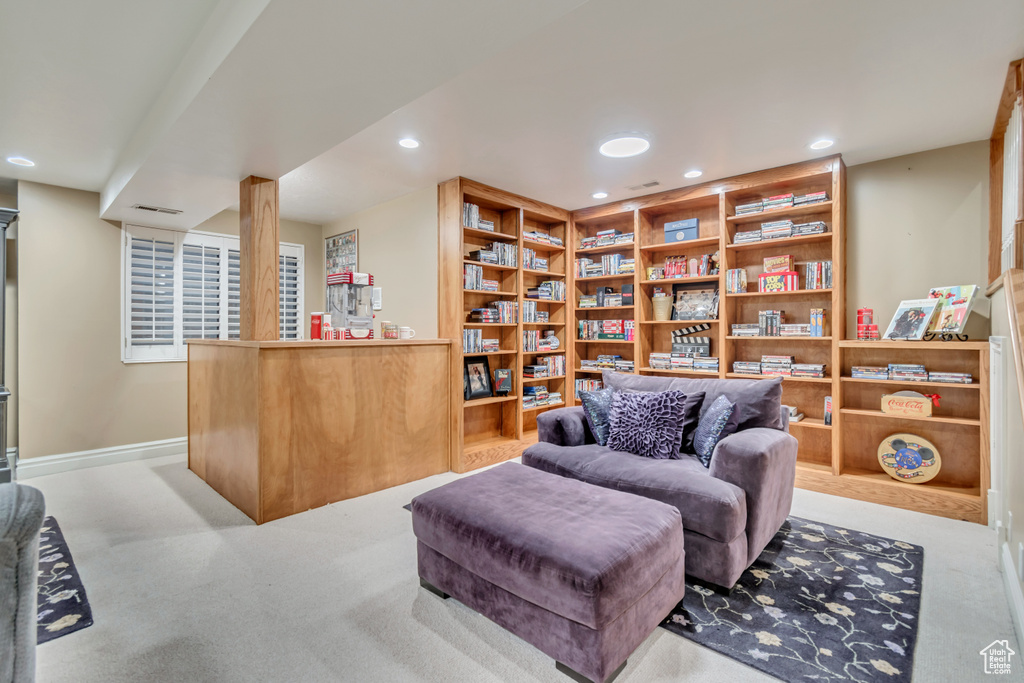 Living area featuring carpet, visible vents, baseboards, and recessed lighting