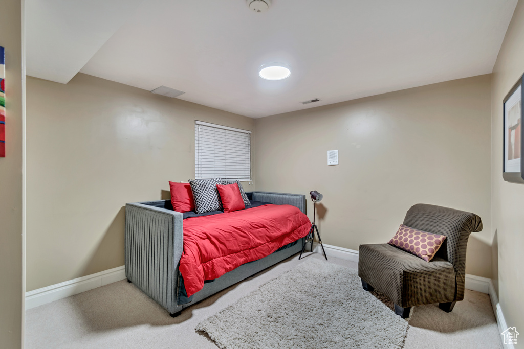 Bedroom featuring carpet floors, baseboards, and visible vents