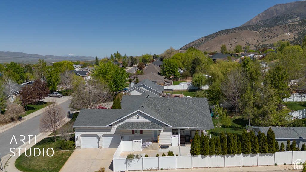 Drone / aerial view featuring a mountain view and a residential view