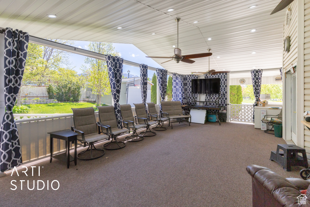 View of patio featuring a fenced backyard and a ceiling fan