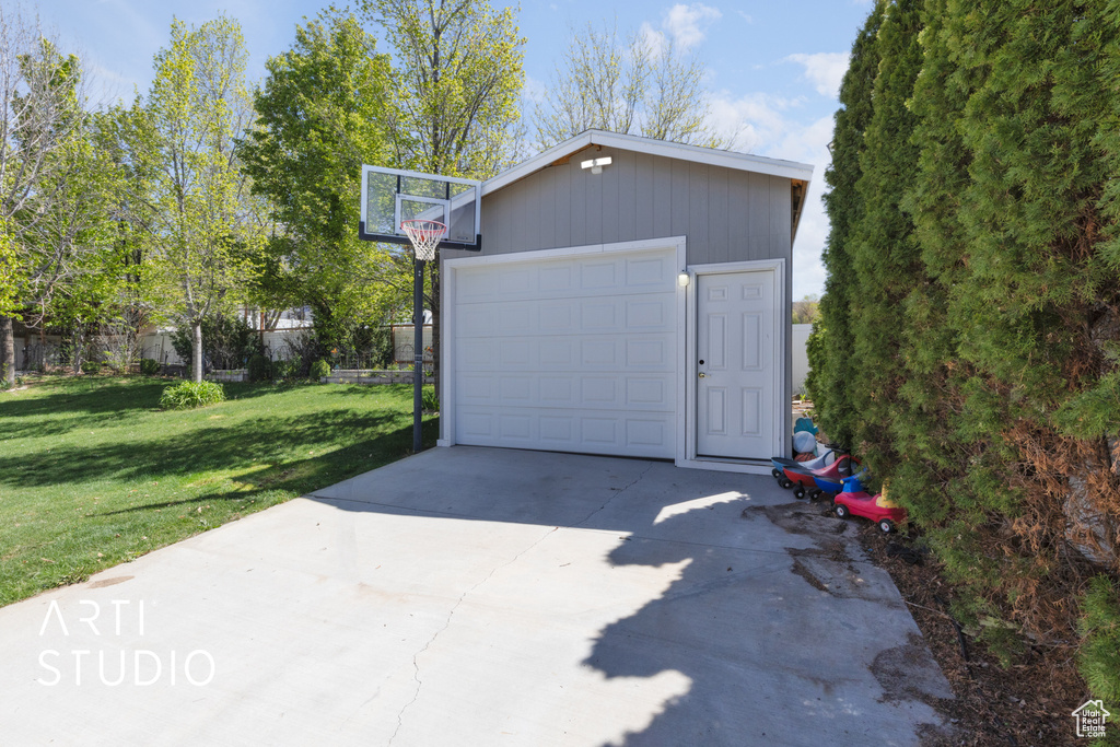 Detached garage featuring driveway