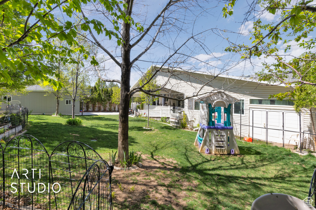 View of yard featuring a playground