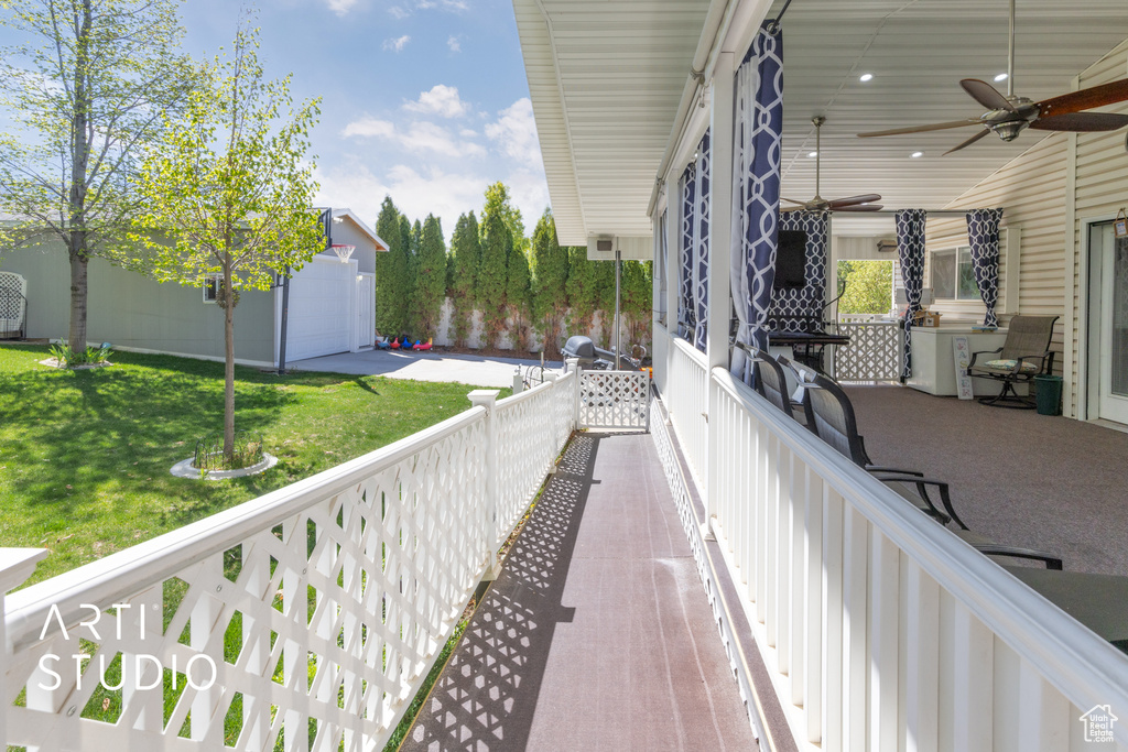 Balcony featuring ceiling fan