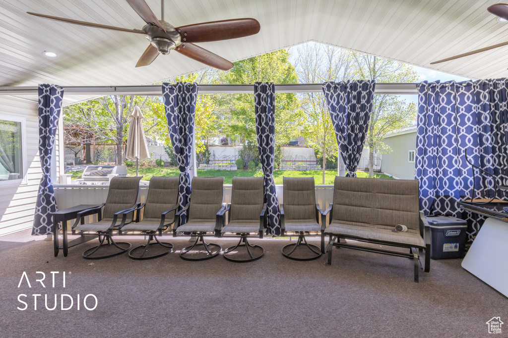 View of patio / terrace with fence and a ceiling fan