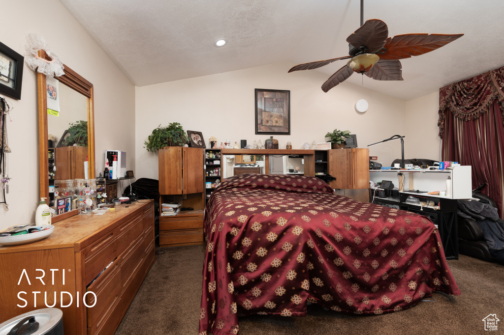 Carpeted bedroom with lofted ceiling