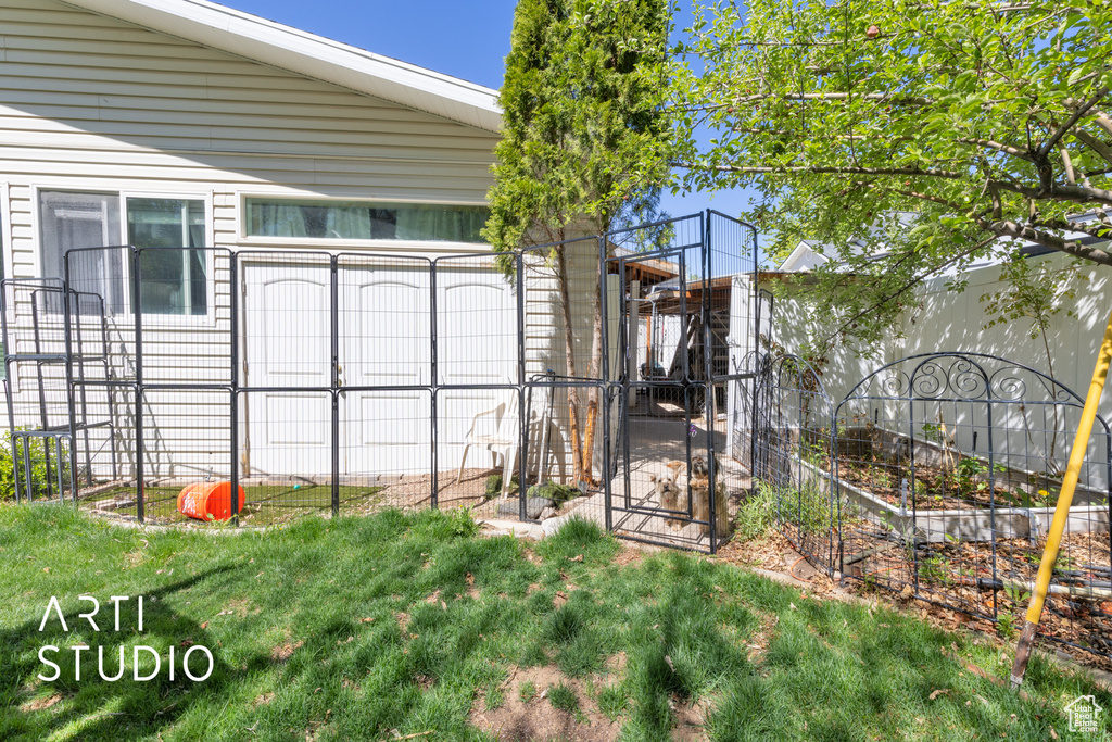 Exterior space with a garden and fence