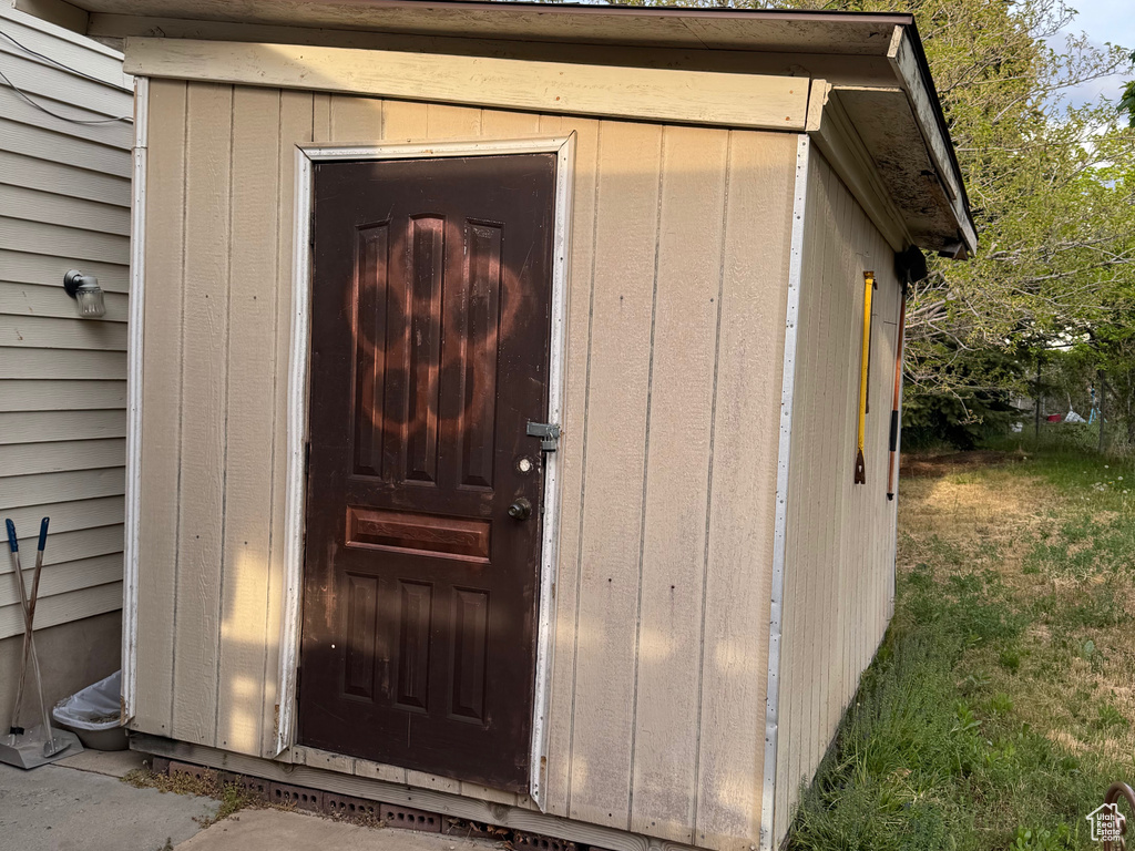 Property entrance with a patio