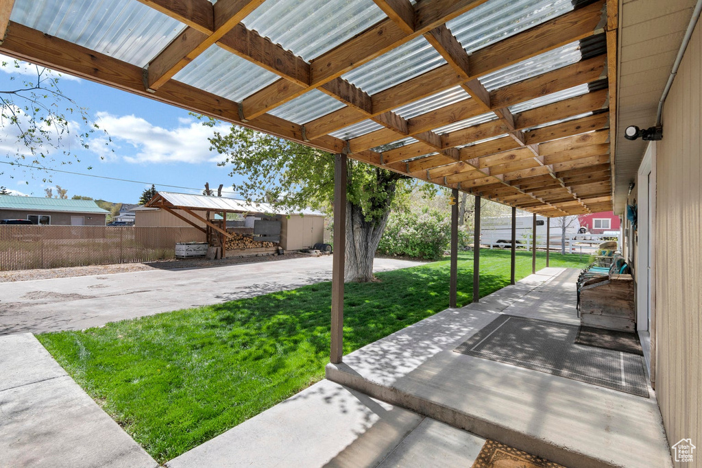 View of patio with fence