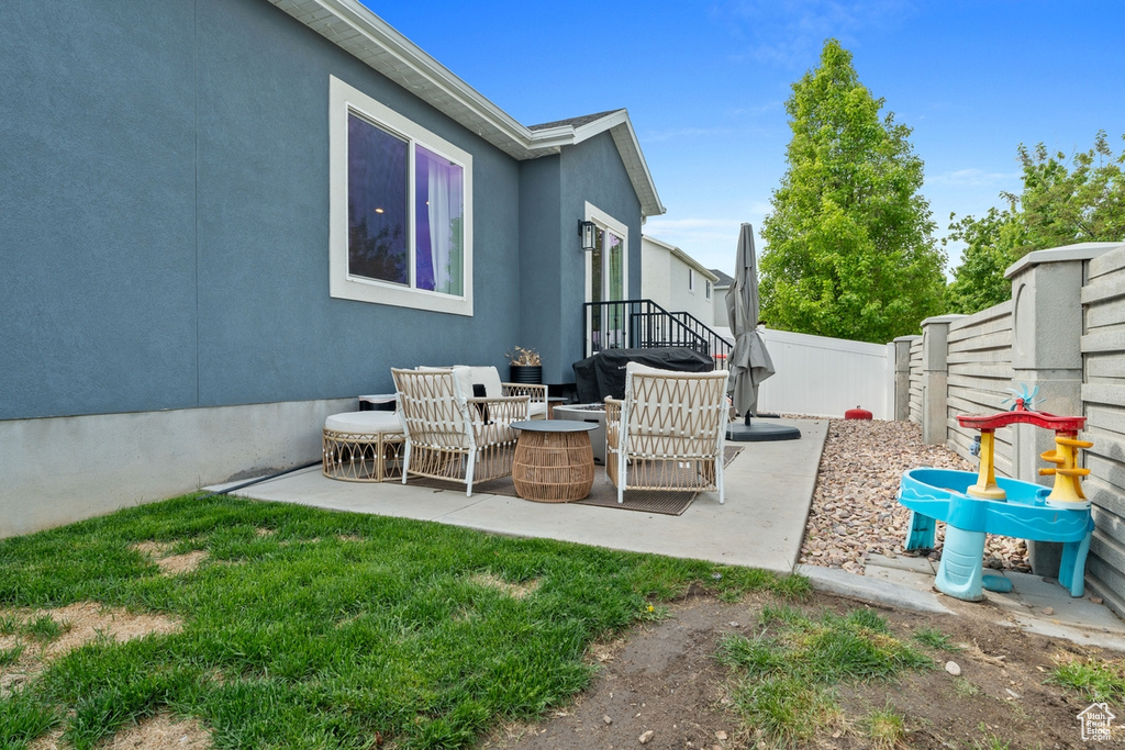 View of patio with a fenced backyard