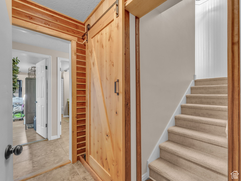 Staircase featuring tile patterned flooring