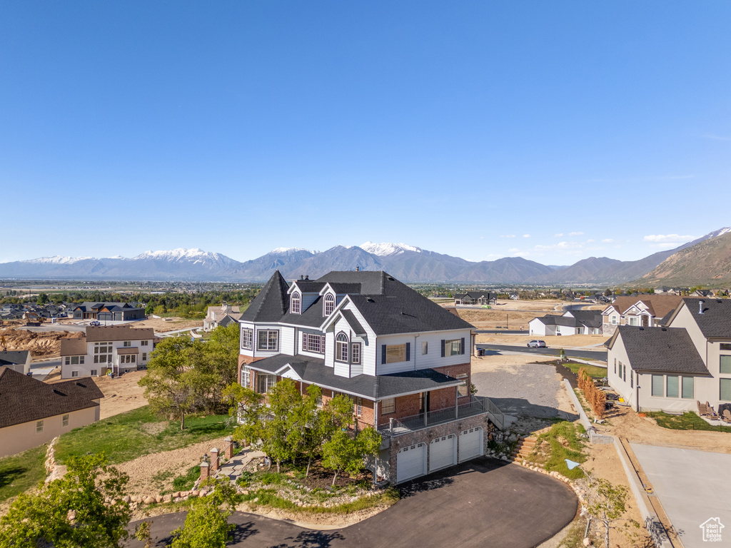 Property view of mountains with a residential view