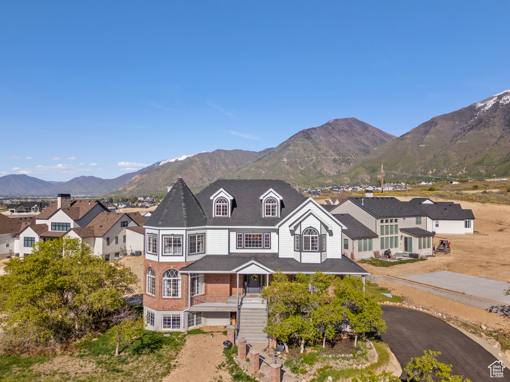 View of front of home with stairway and a mountain view