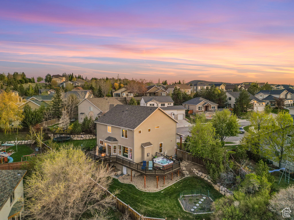 Aerial view at dusk featuring a residential view
