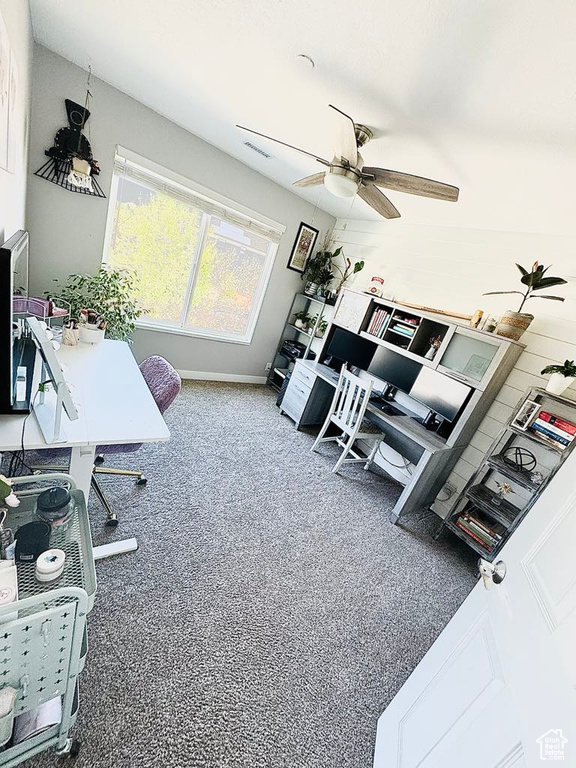 Office area featuring a ceiling fan