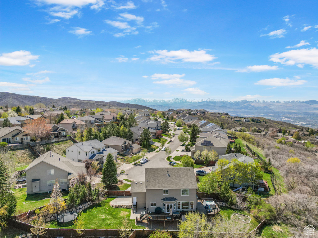 Drone / aerial view featuring a mountain view and a residential view