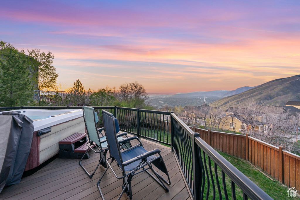 Deck with fence and a mountain view