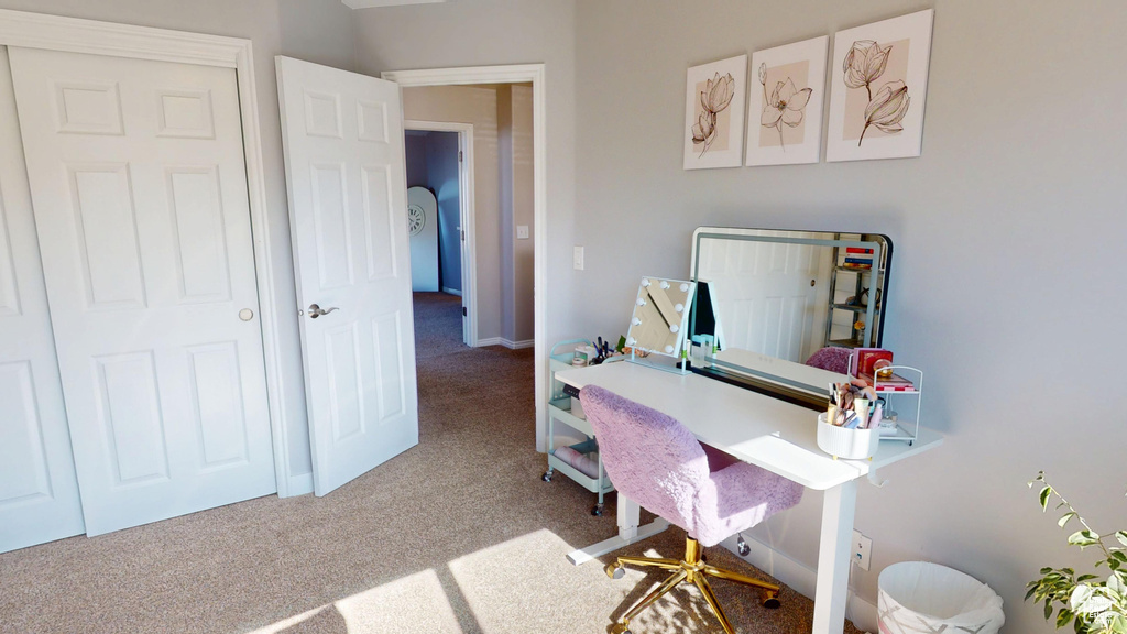Carpeted home office with baseboards